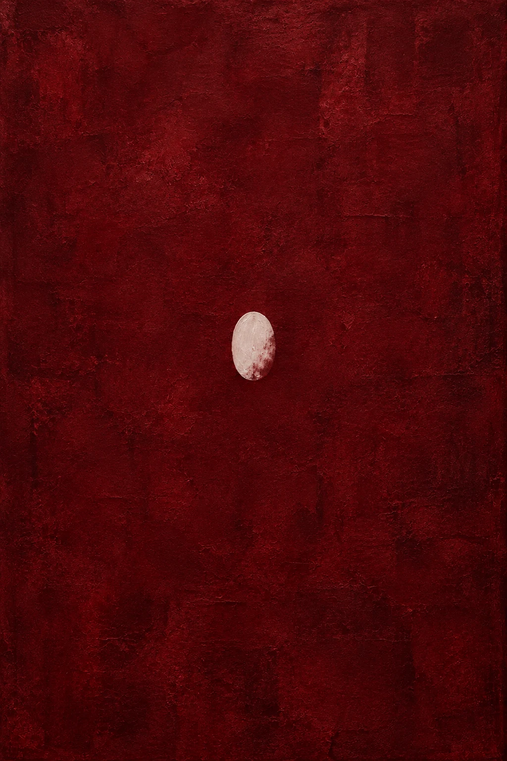 An oval relief on a rough ground in burgundy, black; portrait artwork.