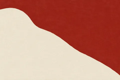 One bold diagonal split, two colors in cream, rust; landscape artwork.