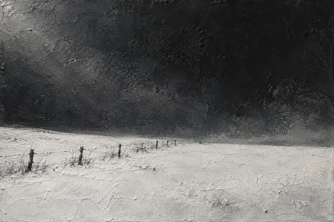 A snowfield with one dark fence line in stone, black, charcoal; landscape artwork.