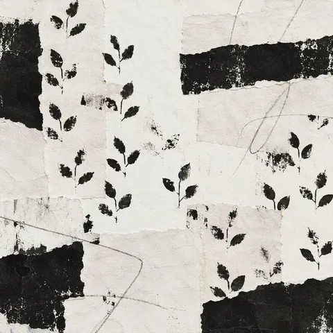 A hand-blocked repeat of small leaves, imperfect registration in cream, black, stone, charcoal; square artwork.