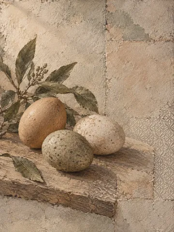 Three eggs on a wooden board in sand, taupe, gray, olive; portrait artwork.
