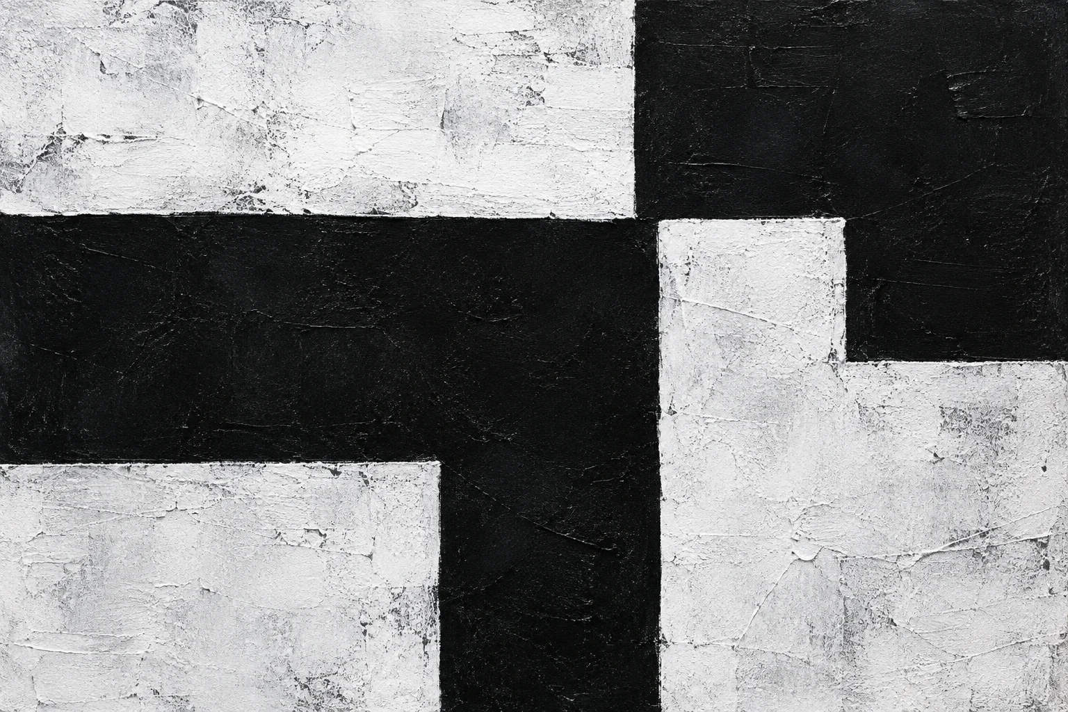 Textured interlocking black and white geometric blocks with right-angle edges.