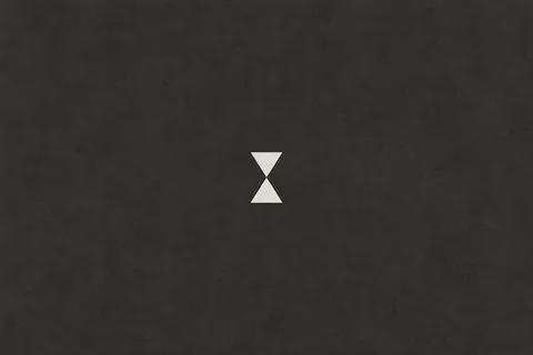 An hourglass of two soft triangles in charcoal; landscape artwork.