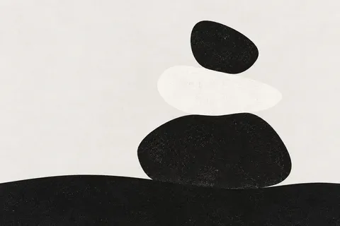 A river stone stack in white, black, cream; landscape artwork.