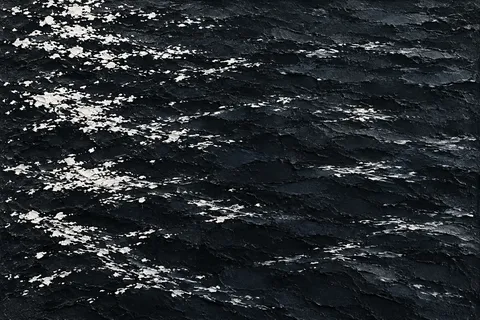 A river surface catching evening light in black, charcoal, gray; landscape artwork.
