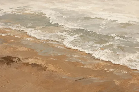 A shoreline foam line seen from above in ochre, cream, sand, stone; landscape artwork.