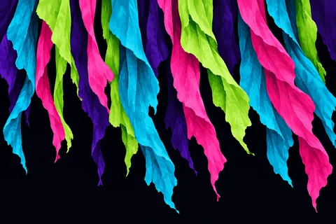 A curtain of hanging torn strips in black, teal, pink, burgundy; landscape artwork.